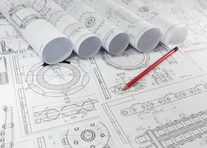 תמונה של גליונות שרטוטים עם עיפרון בצבע כתום